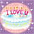 Pixelated circular icon with pink and purple gradient background, featuring red text "LUCY" and small orange squares above it.