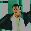 Animated sequence of a person in various poses with microphone and jacket, text 'NIKKi' visible top-left.