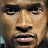 Static 48x48 pixel buddy icon showing a close-up of a person's face with brown skin tone, dark eyebrows, and neutral expression against a blurred background.