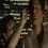 A pixelated animated sequence shows a figure with raised arm against a striped background, transitioning from a side view to a front view.