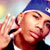 Pixelated static image of a person wearing a blue cap and dark clothing with visible facial features including eyes, nose, mouth, and ear, set against a blurred background with light-colored tones.