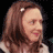 A pixelated image of a person with brown hair and a white headband, alongside red text reading 'ABOUT' on light blue backgrounds.