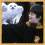 Animated sequence showing a white owl and a person with dark hair in yellow clothing against black background, transitioning between close-up and profile views.