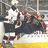 Pixelated hockey scene with players on ice, overlaid with text blocks reading 'real men dont' and 'play with balls' on black backgrounds.