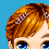 Pixelated close-up of a person's head with light brown hair, blue eyes, and two checkered barrettes against a solid blue background.
