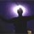 Silhouette of a figure with arms outstretched against a purple and white gradient background with a bright central light source.