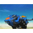 Animated blue and black mechanical creature with orange accents running across a beach under a clear sky in three sequential frames.