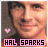 A 48x48 pixel buddy icon featuring a person's face with two animated frames showing a pink heart symbol changing from solid to outlined, and text reading "HAL SPARKS" in black on a light purple background.