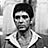 Black-and-white pixelated static image of a person with short dark hair wearing a white collared shirt, displayed as an AIM buddy icon on a gray background.