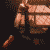 Animated contact sheet showing sequential frames of a pixelated character with brown skin and orange clothing performing actions against a dark background, including text overlays reading "NIN" in various styles.
