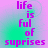 Pixelated text 'life is ful of suprises' in purple on a gradient background with cyan and magenta hues.