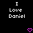 Black background with white pixelated text reading "I Love Daniel" in two identical vertical , each accompanied by a pink heart symbol below