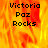 Pixelated text 'Victoria Paz Rocks' on a fiery orange-yellow background with one section grayed out.