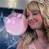 A blonde woman appears in multiple static and animated views with varying expressions, clothing, and background elements including hearts and text.