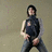 A pixelated figure in a dark sleeveless top and jeans stands against a muted background with red text above.