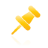 A pixelated yellow pin icon with gradient shading, positioned diagonally against a solid gray background.