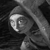 Black-and-white animated frames show a skeletal character with large eyes and a hooded figure, alongside text reading "Tim Burton's The Nightmare Before Christmas" in orange script.