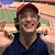 A pixelated image shows a person in a red cap and dark shirt against a blurred background, with green text reading "Original Icons .com" on the right side.