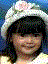 A child wearing a white hat with pink flowers appears in multiple poses and expressions