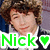 Pixelated image of a person with brown curly hair wearing a white shirt and dark jacket, overlaid with green text 'Nick' and a heart symbol.