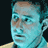Pixelated static image of a person's face with blue-toned skin and brown hair against dark background, likely from Ocean 11 movie fandom context.