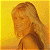 A pixelated contact sheet showing two frames of an animated buddy icon with a woman on the left and green text on the right against a yellow background.