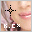 Pixelated image of a person's face with lips and hair, featuring a black cross symbol above text reading 'K.CX' in white or pink pixels.