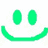 Green pixelated smiley face with two oval eyes and a curved mouth on white background.