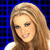 Pixelated portrait of a smiling person with long light brown hair against a blue grid background, wearing a white top.