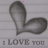 Gray leaf-shaped icon with rainbow pixel trails above and below text reading 'I LOVE YOU' on lined paper background.