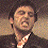 A 2x2 contact sheet of three animated frames from a buddy icon featuring a man in a suit, pink text reading "BTB REPPIN' THE IC", and brown text on a peach background reading "Buddy Putty .com".