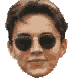 20 pixelated faces transitions from human-like to alien forms across four , with consistent dark sunglasses and brown hair in the first two