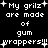 Pixelated text on black background reads 'My grilz are made of gum wrappers!!!' with white plus signs scattered around.