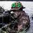 A pixelated image of a soldier in camouflage uniform and helmet holding a rifle, with green text above the head changing across frames.