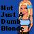 Pixelated static image shows a person with blonde hair holding a microphone against blue background, with text "Not Just A Dumb Blonde" on left.