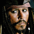 Pixelated image of a man with long dark hair and a mustache, wearing a dark hat and earring, with text reading "Only Real Men Wear Eye Liner" on a black background.