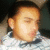 Pixelated close-up of a person's face with closed eyes, light skin tone, and short dark hair against a blurred background.