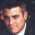 A pixelated image of a man in profile on the left, with green text reading 'Original Icons .com' on a dark background to the right.