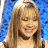 A split-frame contact sheet showing a pixelated image of a smiling woman with long blonde hair on the left and green text reading "Original Icons .com" on a dark green background on the right.