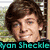 A pixelated image of a person with brown hair and blue eyes, wearing a dark shirt, overlaid with cyan text reading "Ryan Sheckle is so HOT!!!".