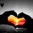 Animated heart-shaped sunset scene with hands forming a heart shape, transitioning from a full sunset to a gray background.