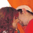 Two figures embrace in a pixelated image; one wears a red shirt and orange hat, the other a white shirt. The text "vondy" appears at the bottom.