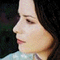 nine distinct head-and-shoulders portraits showing a woman with long dark hair in various poses, expressions, and clothing against different backgrounds