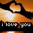Pixelated image of two hands forming a heart shape above text reading 'i love you' on an orange gradient background.