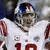 A pixelated image of a football player in a white uniform with red accents and the number 10, next to text showing 'Giants-17 Patriots-14' on a white background.