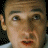 A pixelated contact sheet showing two frames of an animated icon: a close-up of a person's face on the left and a red object with number 2 on the right, both against black background.