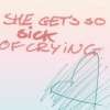 A static image with handwritten-style text reading "SHE GETS SO SICK OF CRYING" in red, over a light pink background with faint blue sketch lines.