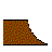 Pixelated abstract shape with irregular black border, composed of red, green, and brown squares on white background.