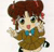 Pixelated cartoon character with brown hair, green eyes, and a blue bow tie, wearing a brown outfit and holding a small object.