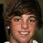 A pixelated image of a person with brown hair and a white shirt, alongside red pixelated text reading 'RYAN SHECKLER' and 'MAJOR HOTTIE!!' on white and gray backgrounds.